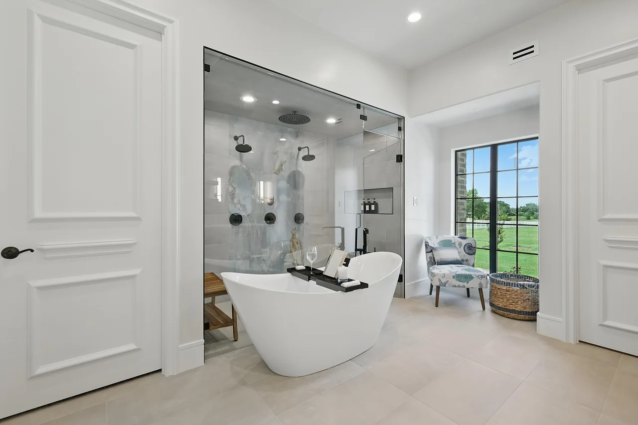 Spa-style primary bathroom remodel by Copper Oak Renovations