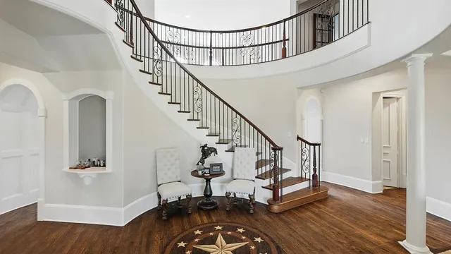 Curved staircase foyer