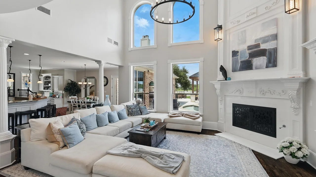 Living room with custom fireplace surround by Copper Oak Renovations