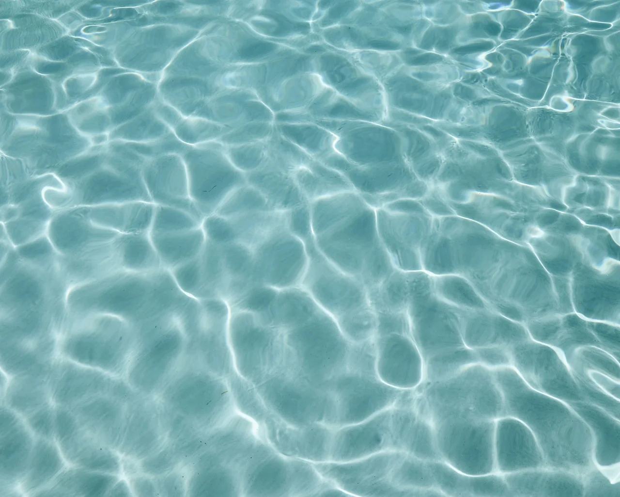Close-up of fresh pool finish and water
