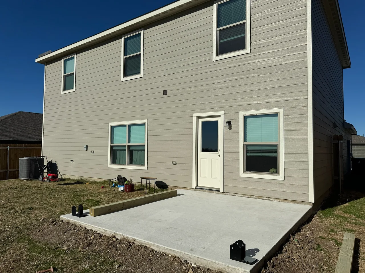 Patio slab, two-story home